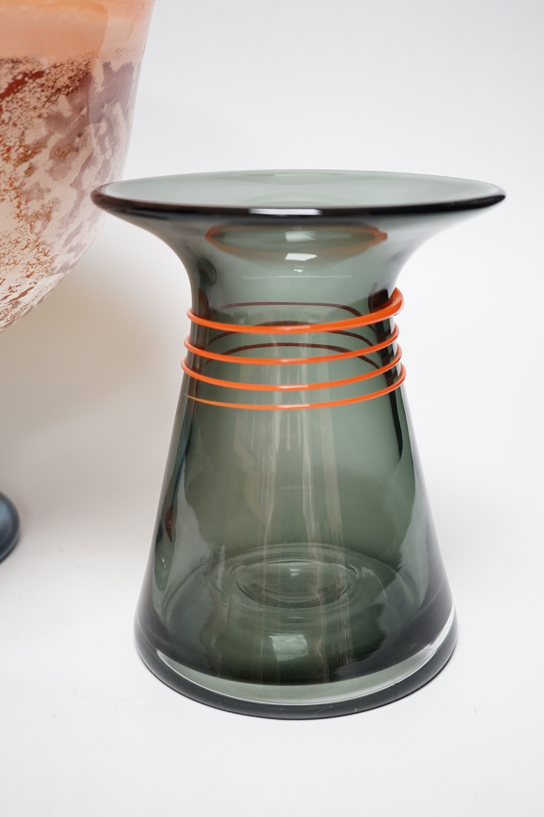 An large Kosta Boda art glass pedestal centrepiece indistinctly signed and a Dartington vase with trailed decoration, the largest 26cm high